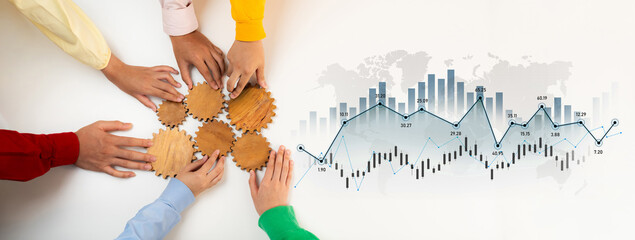 A vibrant display of diverse hands working together to assemble wooden gears, symbolizing teamwork...