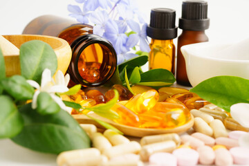 Alternative medicine herbal organic capsule with vitamin E omega 3 fish oil, mineral, drug with herbs leaf natural supplements for healthy good life.