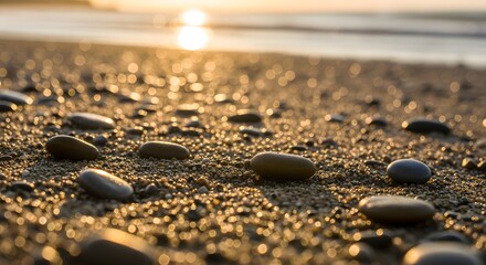Beach rocks sunset golden hour sand pebbles coastline ocean water horizon scenic tranquil landscape