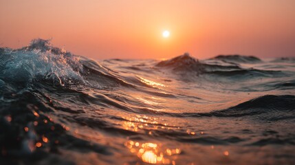 Ocean waves crest and crash beneath a warm setting sun.