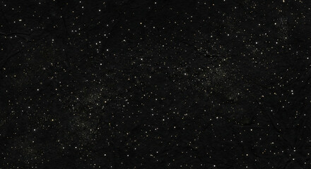 Dark background filled with tiny glowing specks resembling stars or glitter, creating an elegant and minimal festive texture