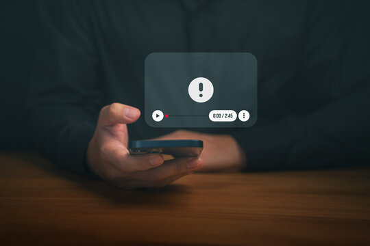 A warning icon appears on a mobile video player interface, highlighting issues such as playback error, unsafe content, cybersecurity risk, digital media failure, and online safety awareness.