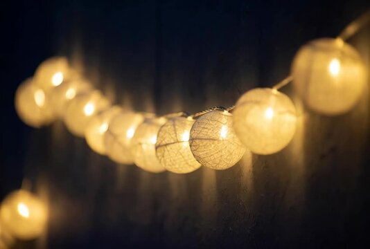 Illuminating moments a cozy string of warm white lights shining against a dark surface