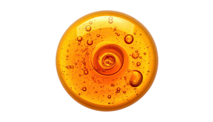 A golden orb of swirling liquid with bubbles against a stark black background