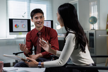 Business colleagues collaborating and discussing ideas in office