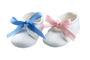 Pair of white baby shoes with blue and pink ribbons