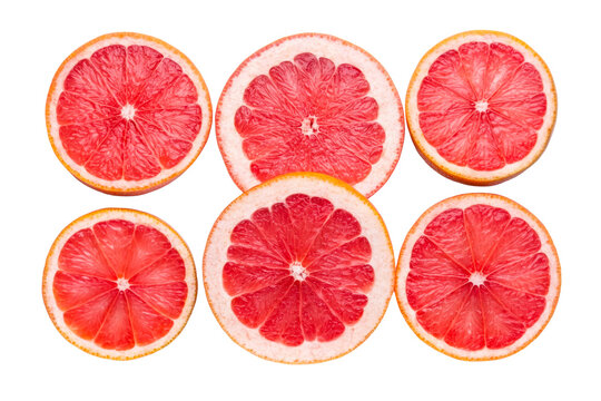 Collection of perfectly sliced ruby red grapefruit halves displaying vibrant color and juicy segmented pulp arranged symmetrically for healthy eating concepts and food supplement promotion