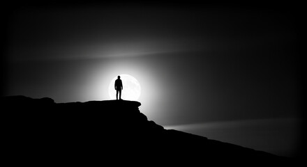 Dramatic Silhouette of a Lone Figure Standing on a Cliff Edge Against a Bright Sun or Moon, Evoking Solitude and Contemplation in Black and White
