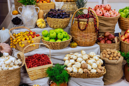 Various fruits vegetables are arranged in baskets, of autumn harvest season at local market