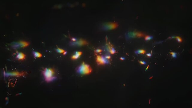 Prismatic light bursts against a dark background