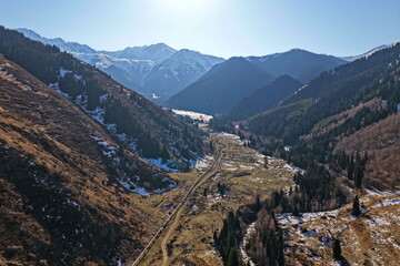 Ile-Alatau National Nature Park. The Tien Shan Mountains, an area with different vegetation, November. The view from the drone.