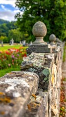 Stone Wall with Finials in a Garden Cemetery.