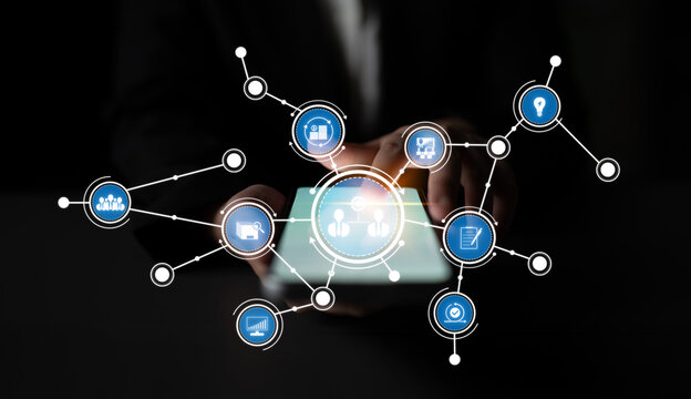 A conceptual image depicting digital connectivity through touchscreen interaction, featuring abstract icons representing technology, communication, and business networking. Crux