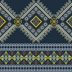 Yellow, green, and blue pixel ethnic boho seamless pattern. Tribal pattern. Folk motif. Textile rapport. Cross-stitch design for textiles, curtains, rugs, fabrics, interior design, and home decoration