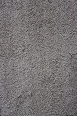 Texture of old gray plaster on a concrete wall.