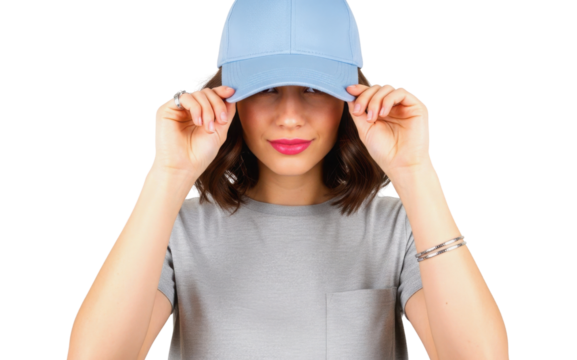 Stylish young woman wearing blank light blue baseball cap isolated on white background