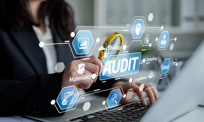 Naklejka premium A professional examines audit findings using a magnifying glass on a laptop, showcasing digital compliance and materiality analysis in a business context. Tessel