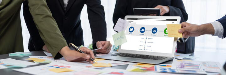Analyst team use sticky note for creative and analytic brainstorm for business idea with BI data dashboard on laptop screen. Analysis financial data visualization tech for marketing strategy. Prodigy