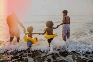 Black family having fun on the beach