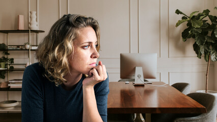 Stress woman sitting thoughtfully alone