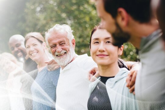 Happy diverse people together in the park - Powered by Adobe