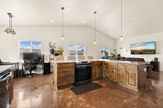 A spacious kitchen featuring a large island situated in the center of the room
