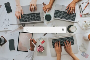 Businesswomen using digital devices at work