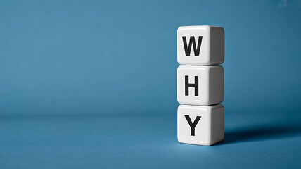 Why Concept with Stacked Letter Blocks on Blue Background Symbolizing Purpose and Motivation