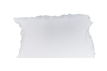 A piece of white paper with torn edges on a black background in a studio shot setting