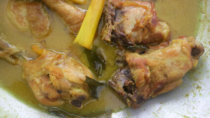 Closeup Shot Of Chicken Cooked In Yellow Broth