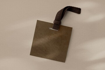 Brown clothing tag, apparel branding with blank design space