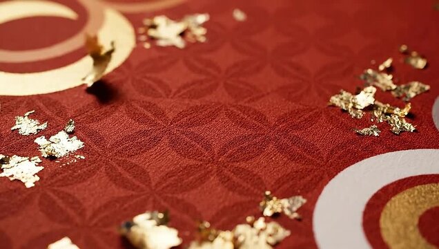 Decorative red fabric with gold leaf and geometric pattern