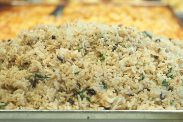 Herb-seasoned rice in a buffet setting