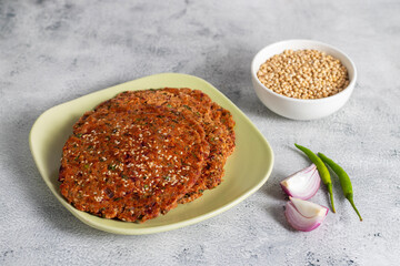 Bajra paratha is a nutritious Indian flatbread made from pearl millet flour, dense, earthy, fiber-rich, gluten-free, warming, ideal for winter meals.
