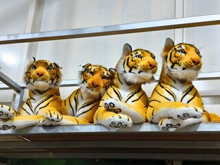 Malaysia November 1 2025 – Plush Tiger Dolls Displayed on Metal Rack in Store Setting