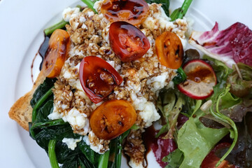Close up plate of tomato salad with Mozzarella cheese