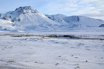 Natural landscape of snowy mountain range with foggy and mist sky, Iceland