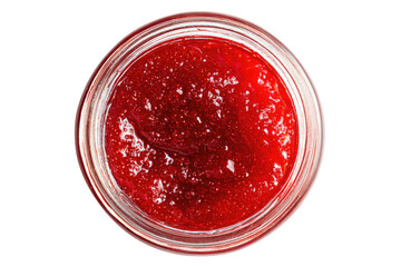 Close overhead view of thick red preserve in a clear glass jar