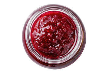 Close-up view from above of a glass jar filled with red berry preserve