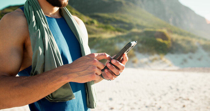 Outdoor, smartphone and man with fitness, hands and online reading with weekend break. Healthy person, exercise and athlete with cellphone, social media and app to track progress and workout schedule