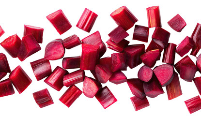 Freshly chopped ruby red vegetable pieces scattered on a dark background