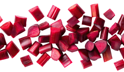 Freshly chopped ruby red vegetable pieces scattered on a dark background