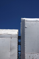 Tall structures temporarily tented for renovation and reconstruction