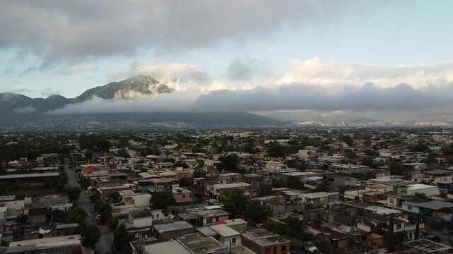 Aerial view of Cerro de la Silla mountain under cloudy sky in Monterrey