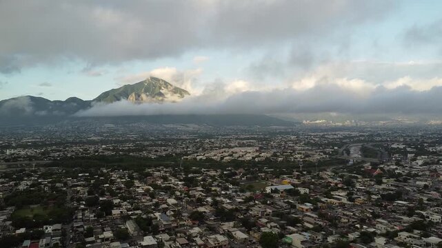 Aerial view of Cerro de la Silla mountain under cloudy sky in Monterrey