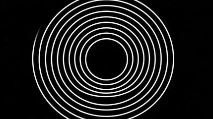 Concentric white circles form a hypnotic pattern on a black background.