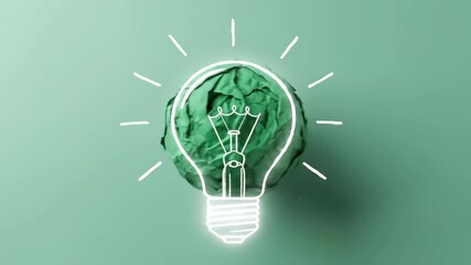 Green idea lightbulb concept with crumpled paper creativity and innovation - Powered by Adobe