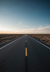 Fototapeta premium A desolate, straight asphalt road cutting through a flat landscape, vanishing far into the horizon beneath the expansive sky ,road ,challenge ,extensive