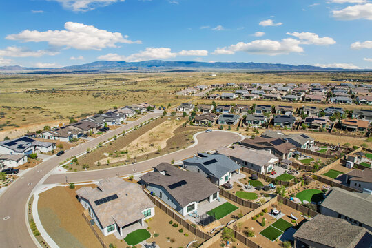 overhead perspective showcasing innovative residential layout with scenic desert and mesa views