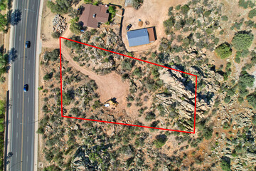 Aerial view of a desert with a red rectangle in the center